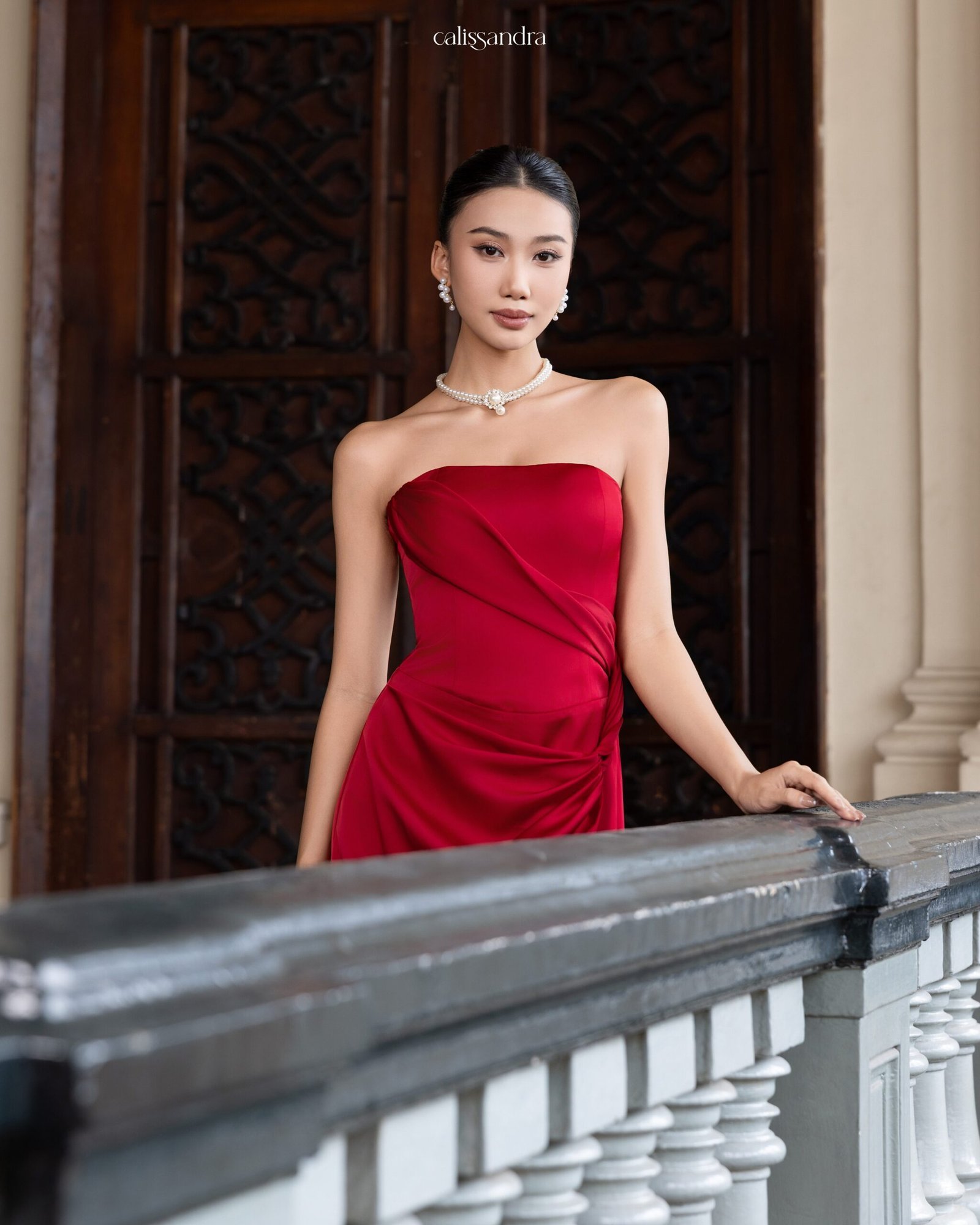 Angeletta burgundy strapless dress with a draped bodice