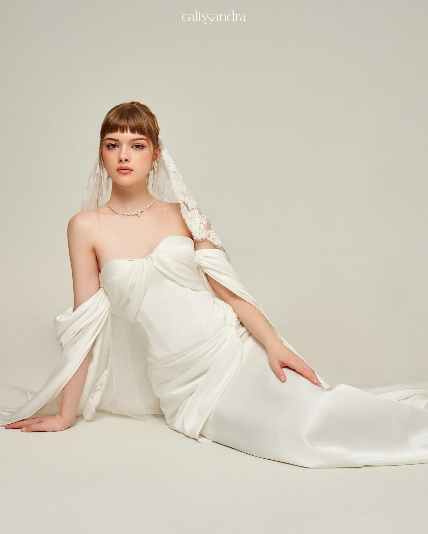 Close-up of the ivory Selmira bridal bodice with floral shoulder detail